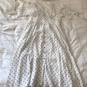 White polka dotted short sleeve summer dress.
